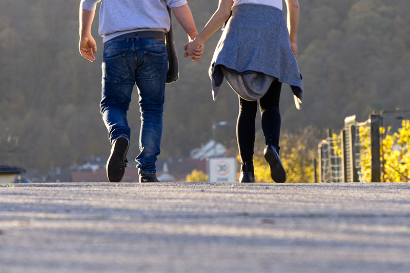 Two people walking together
