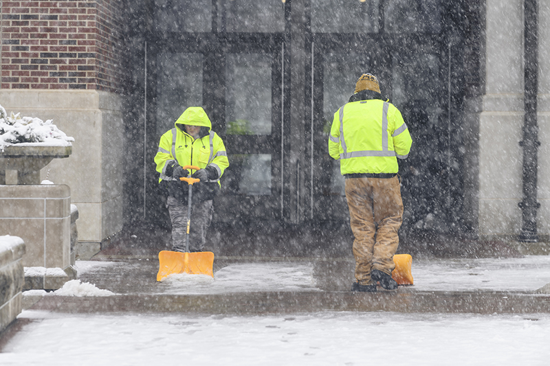 Physical Facilities employees shoveling snow