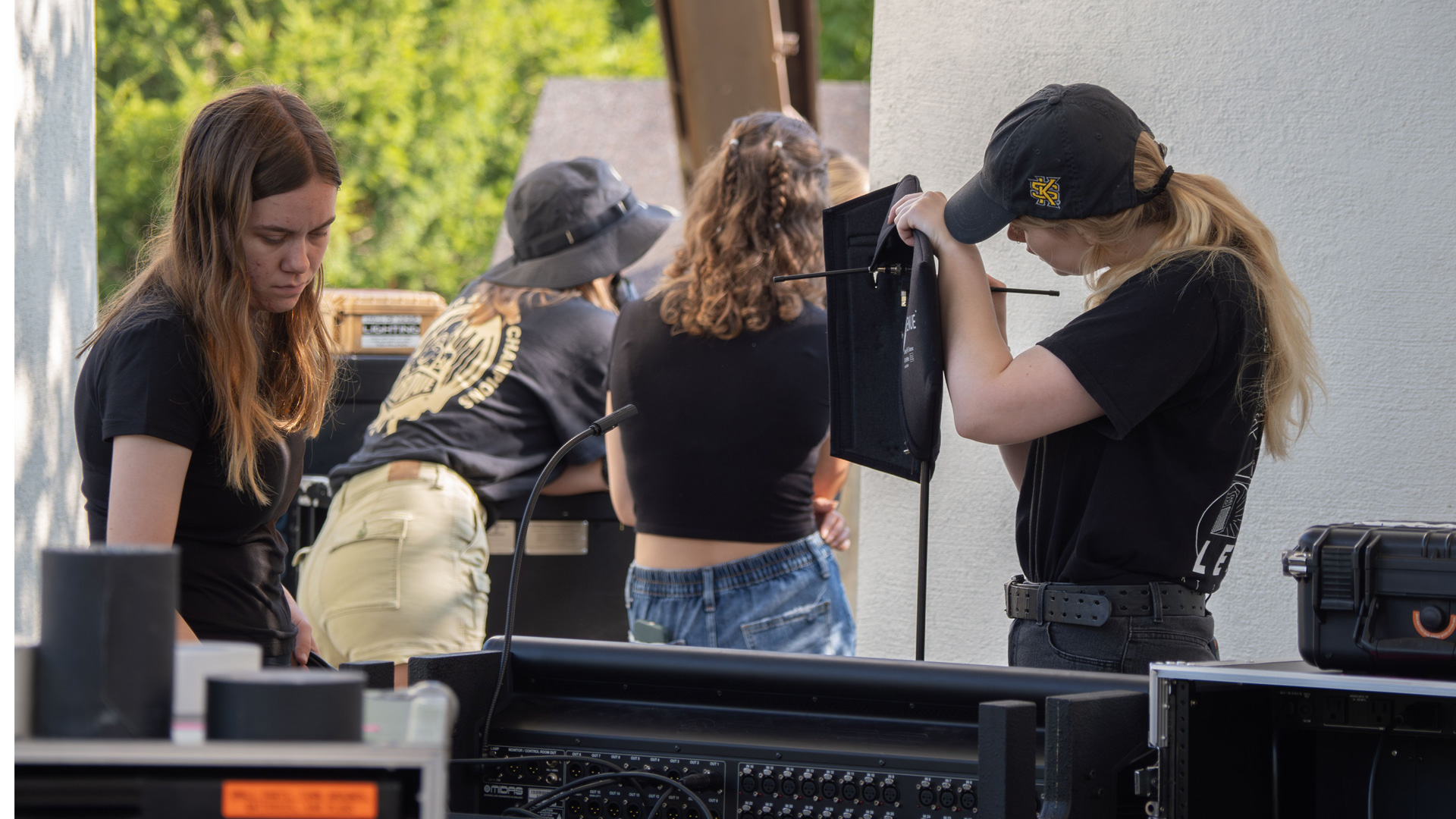 A photo of the live event staff helping set up for a live event