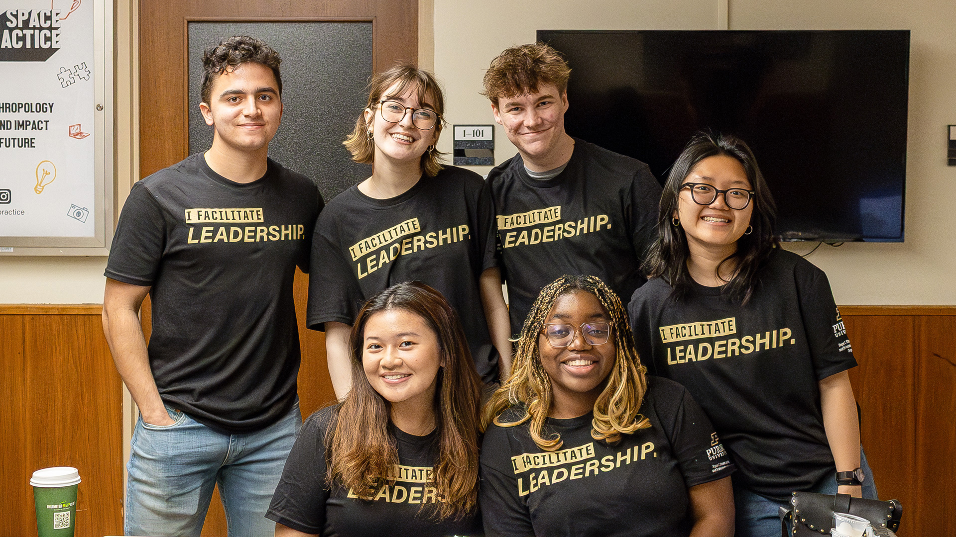 Purdue students in Indianapolis at a Leadership Department display table.