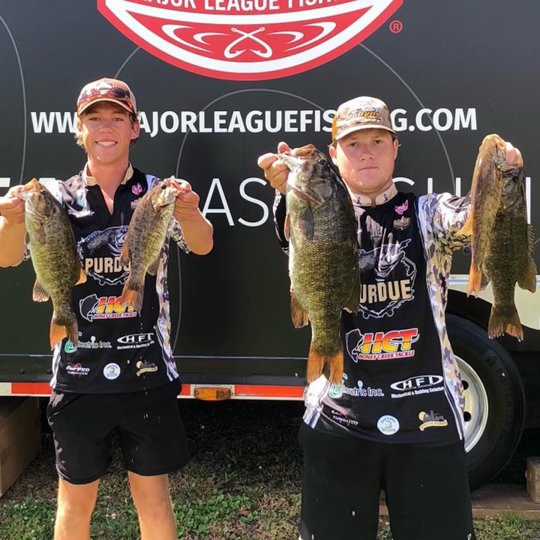 Brady Metzger and Travis Bohland show off their smallmouth bass at the Major League Fishing College Central Conference event in LaCrosse, Wisconsin.