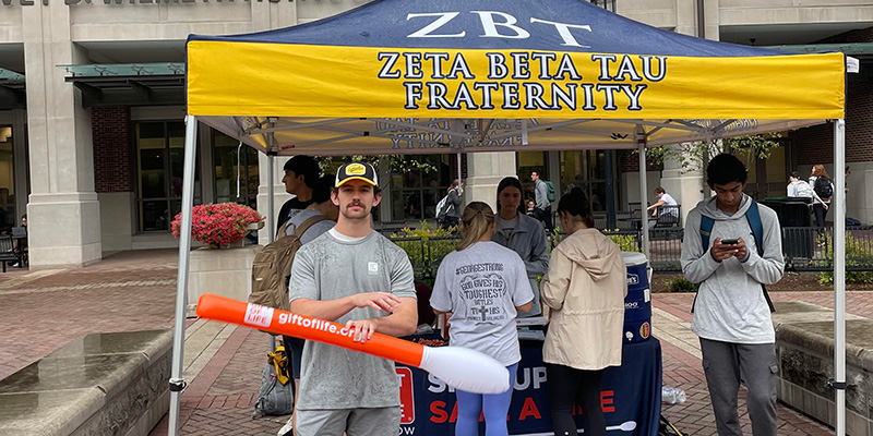 Members of the Alpha Alpha Chapter of ZBT pose for a picture in front of WALC.