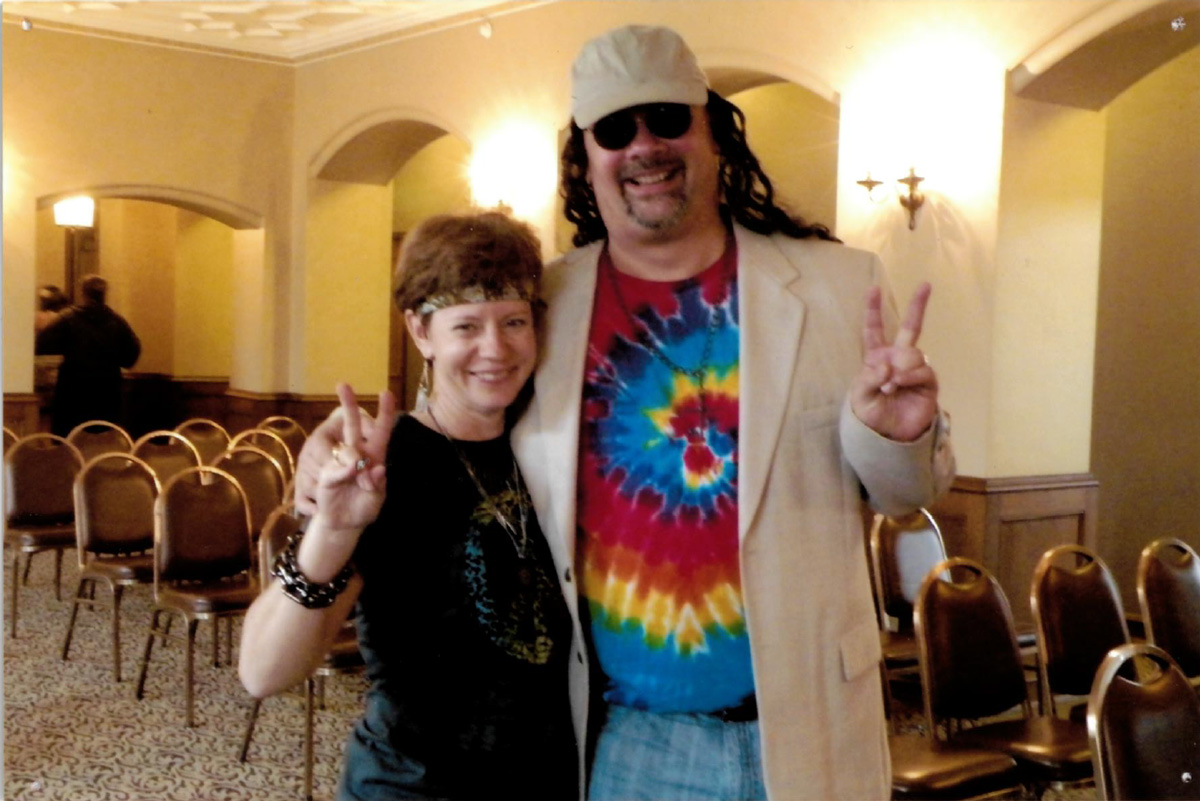 Tim and Sally Luzader attending a Woodstock themed Murder Mystery party.