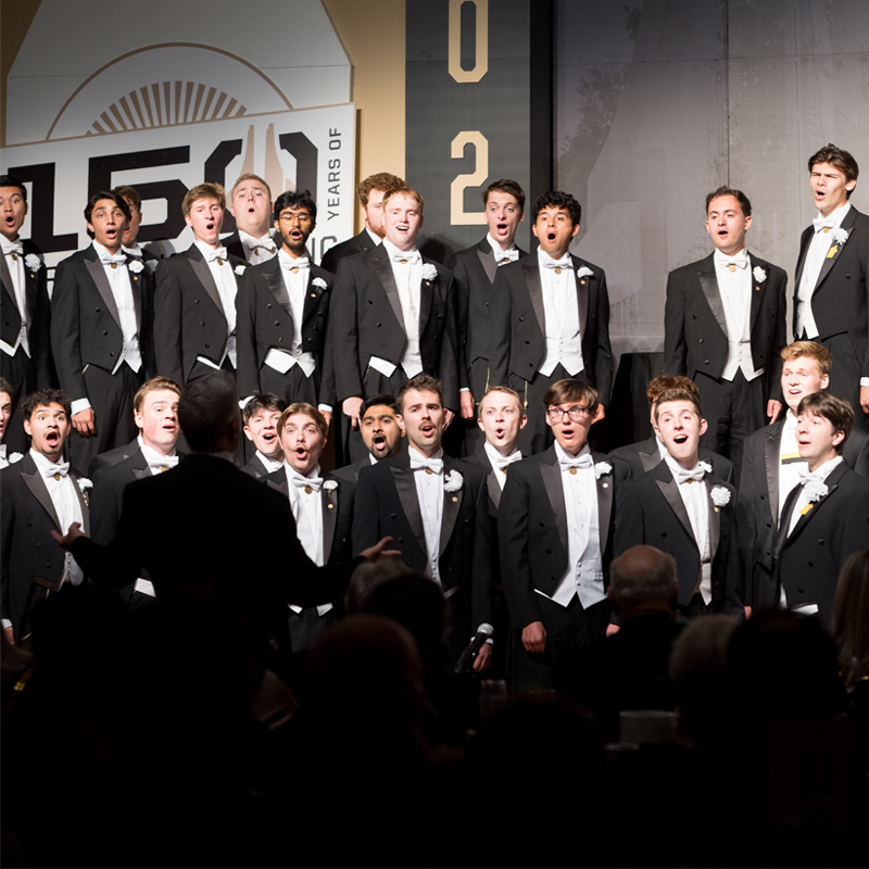 a photo of the glee club performing for Alumni celebrating 150 years of Engineering at Purdue 