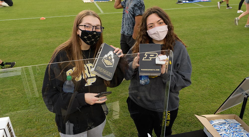 Students holding popcorn at a Ross-Ade Movie Night