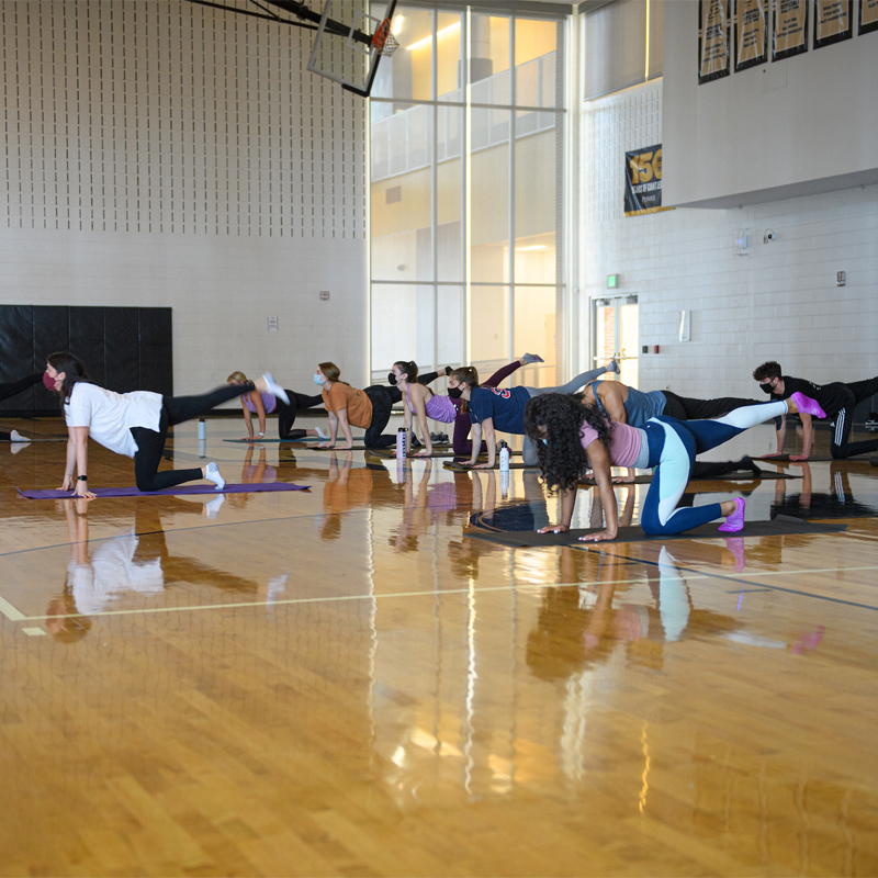Students participating in yoga classes at the CoRec, hosted as part of a Purdue Reading Day.